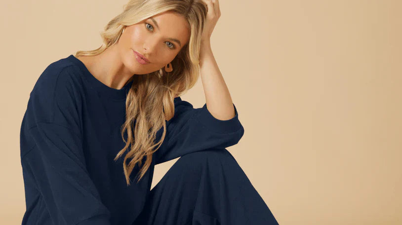 Woman contemplating what makes loungewear truly comfortable