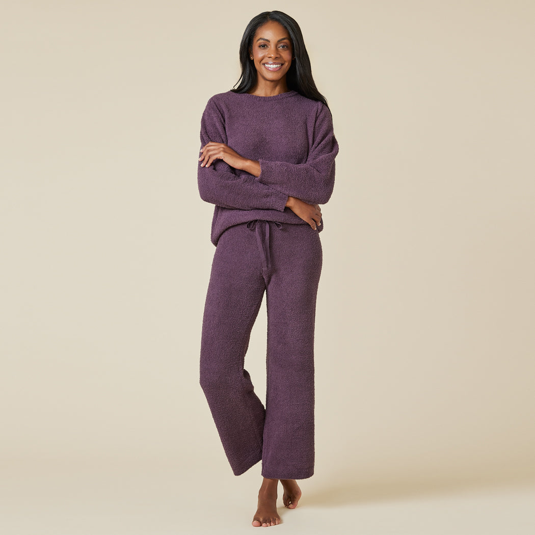 A woman wearing a purple loungewear set