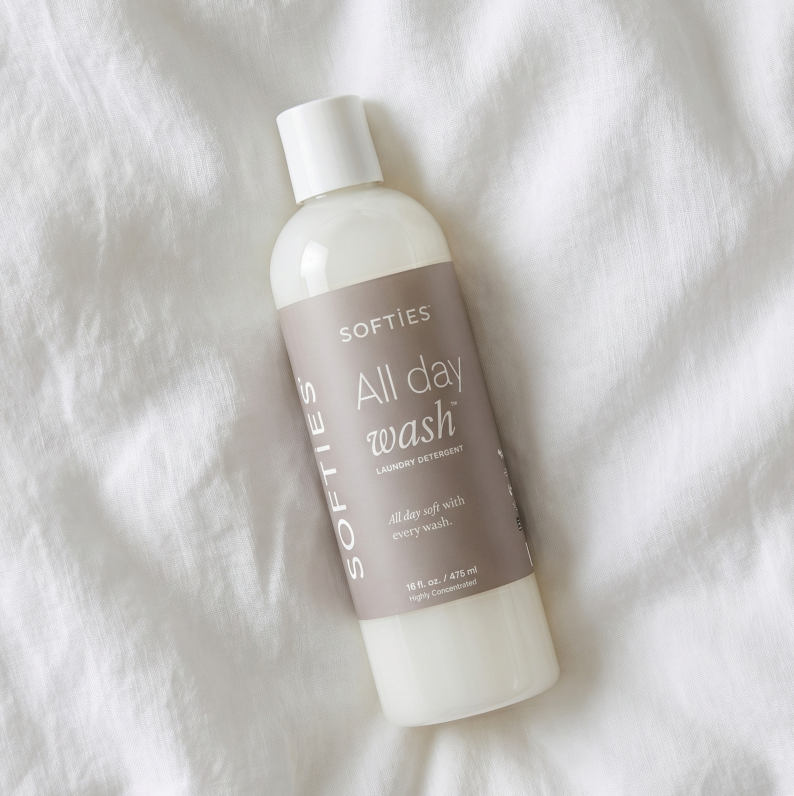 Bottle of Softies All Day Wash on a white textured background